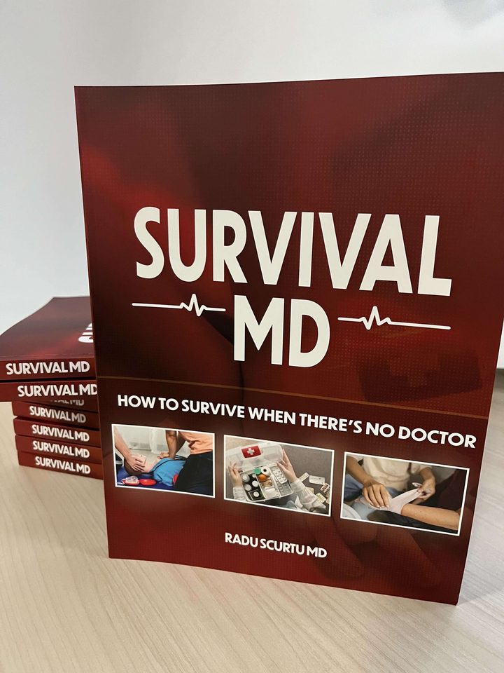Survival MD by Dr. Radu Scurtu, the full-color printed edition, standing in front of a stack of copies