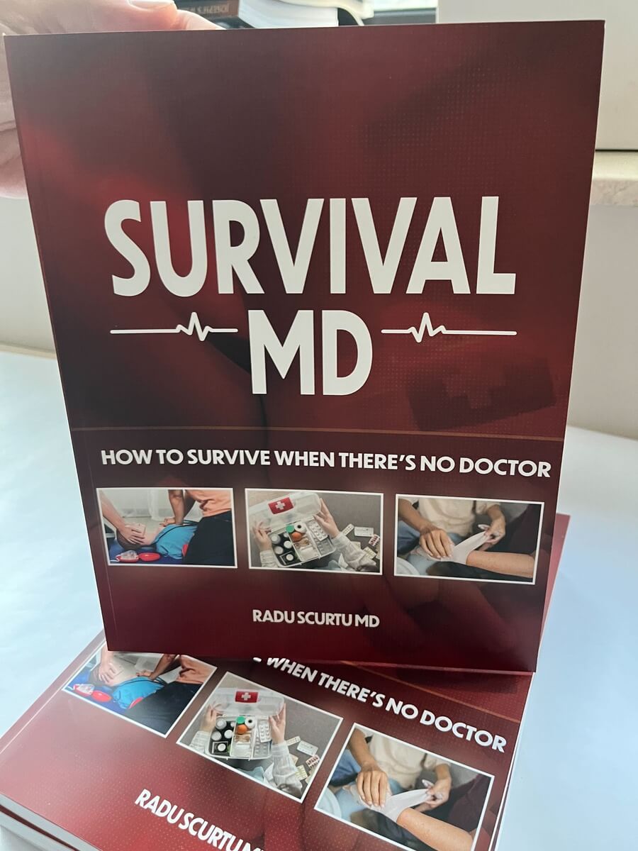 The real printed Survival MD book held in hand